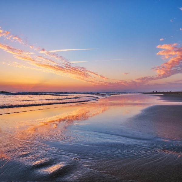Atlantic ocean after sunset with surging waves at Fonte da Telha beach, Costa da Caparica, Portugal